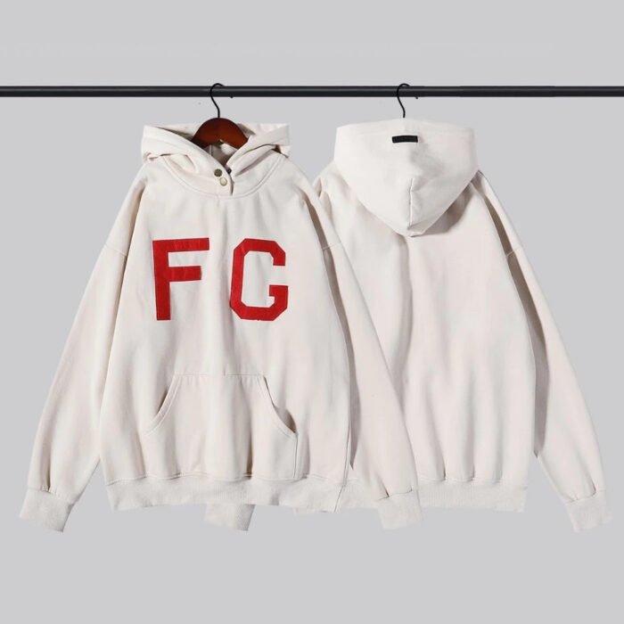 A white sweatshirt adorned with the fg logo, showcasing a simple yet stylish design.