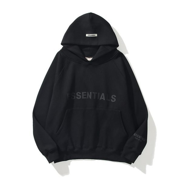 A black hoodie featuring the word "essentials" prominently displayed on the front.