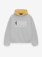 A grey sweatshirt featuring the text "Sparks Essentials" prominently displayed on the front.