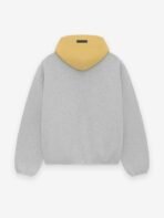 A grey sweatshirt featuring the text "Sparks Essentials" prominently displayed on the front.