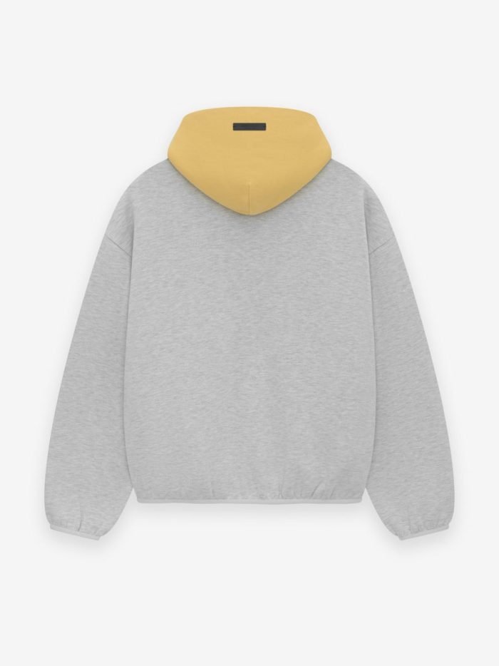 A grey sweatshirt featuring the text "Sparks Essentials" prominently displayed on the front.