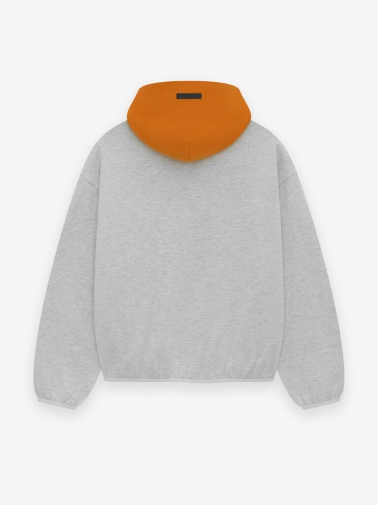 A grey sweatshirt adorned with vibrant orange text.