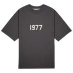 A black t-shirt featuring the year "1977" prominently displayed on the front.