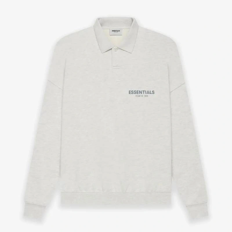 White polo shirt featuring a logo on the left chest area.