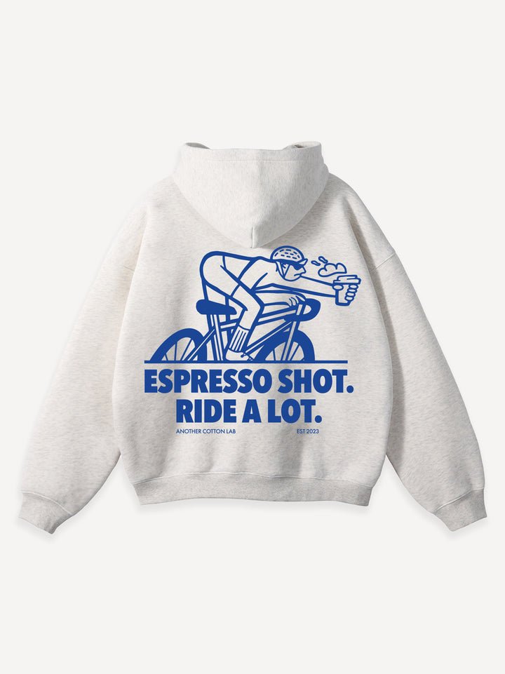 A cozy white sweatshirt displaying the fun slogan "espo doot ride a lot" prominently across the front.